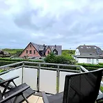 Wellenreiter am Meer